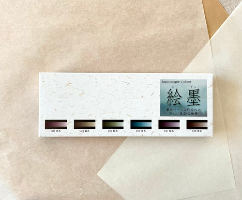 Boku-Undo Ezumi Classic watercolor set box showing six shadow black color swatches on kraft paper background