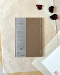 Kleid B6 brown notebook full cover with grey label band on washi paper and dried rose petals