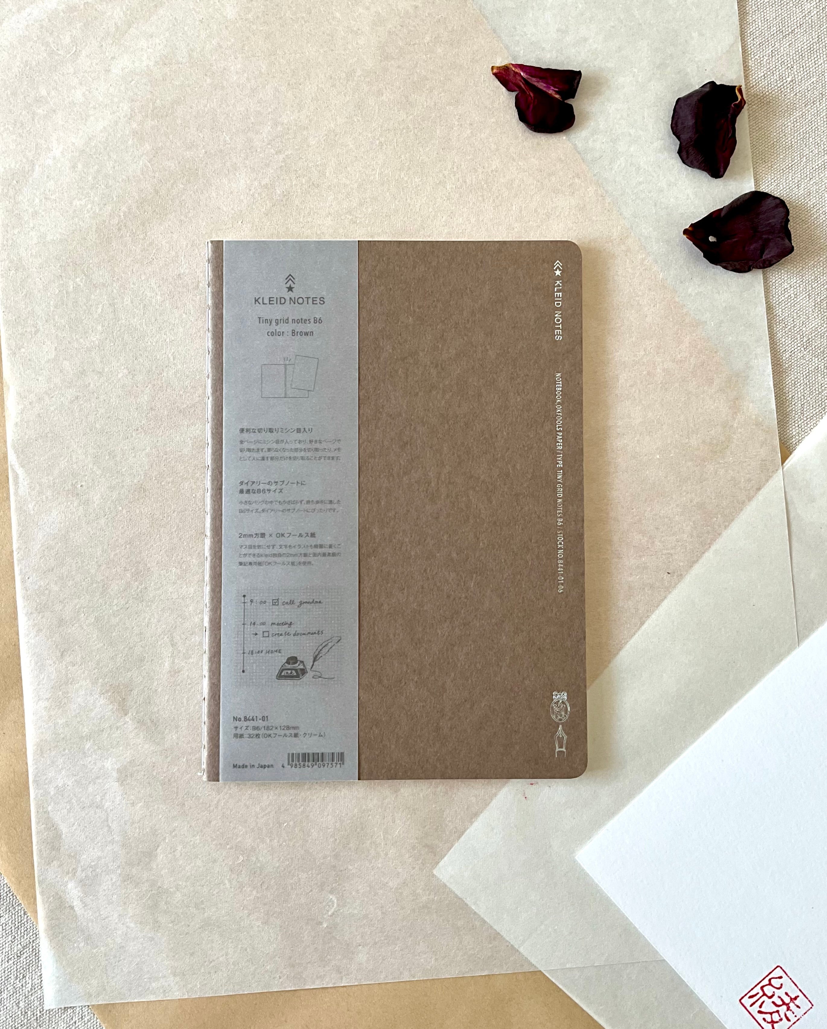 Kleid B6 brown notebook full cover with grey label band on washi paper and dried rose petals