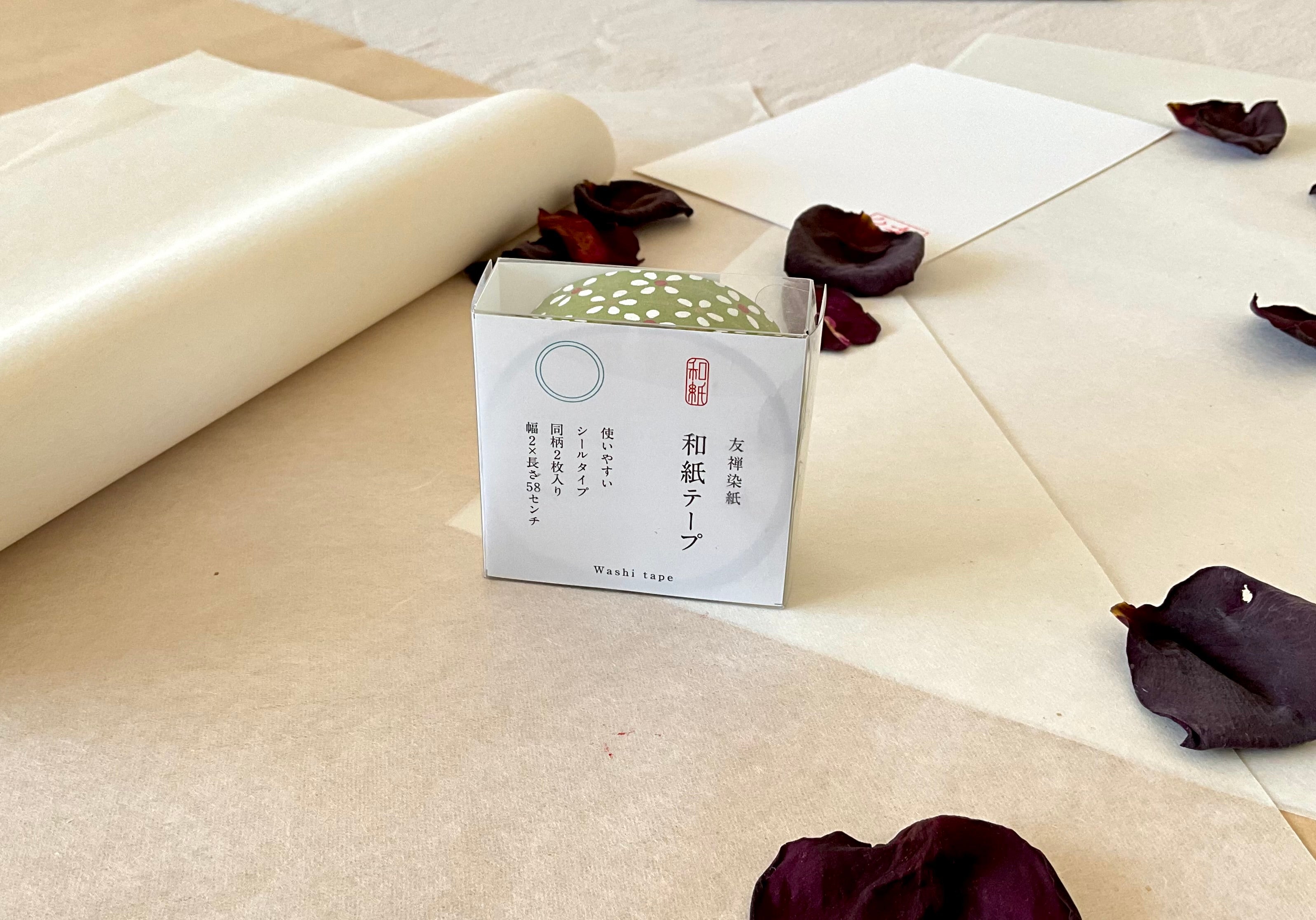 Sealed Shogado yuzen washi tape box with Japanese product label reading washi tape, two sheets same pattern, 2cm by 58cm, Olive green with white daisy and red center floral print, on layered washi paper with dried rose petals