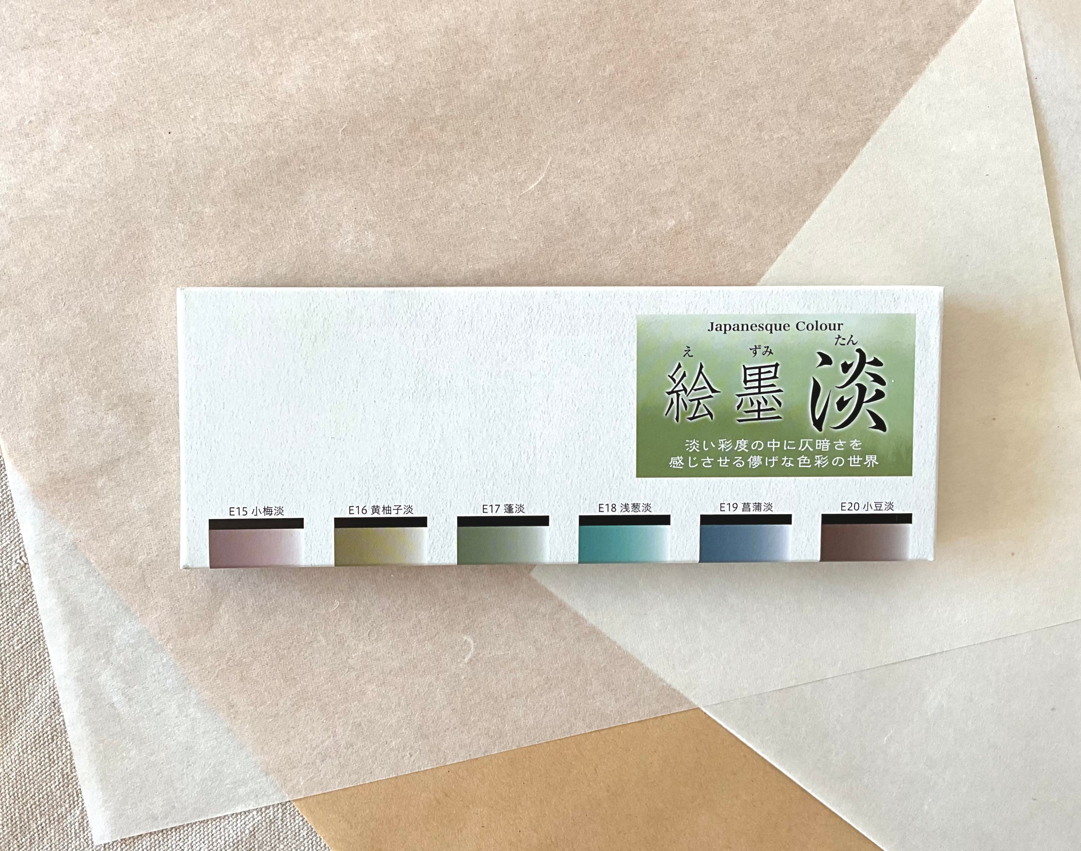Boku-Undo Ezumi Tan pale colour watercolor set box showing six soft color swatches on layered washi paper