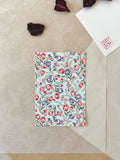 Morita Washi tulip pattern postcard showing dense pink and purple floral repeat on pale blue washi paper