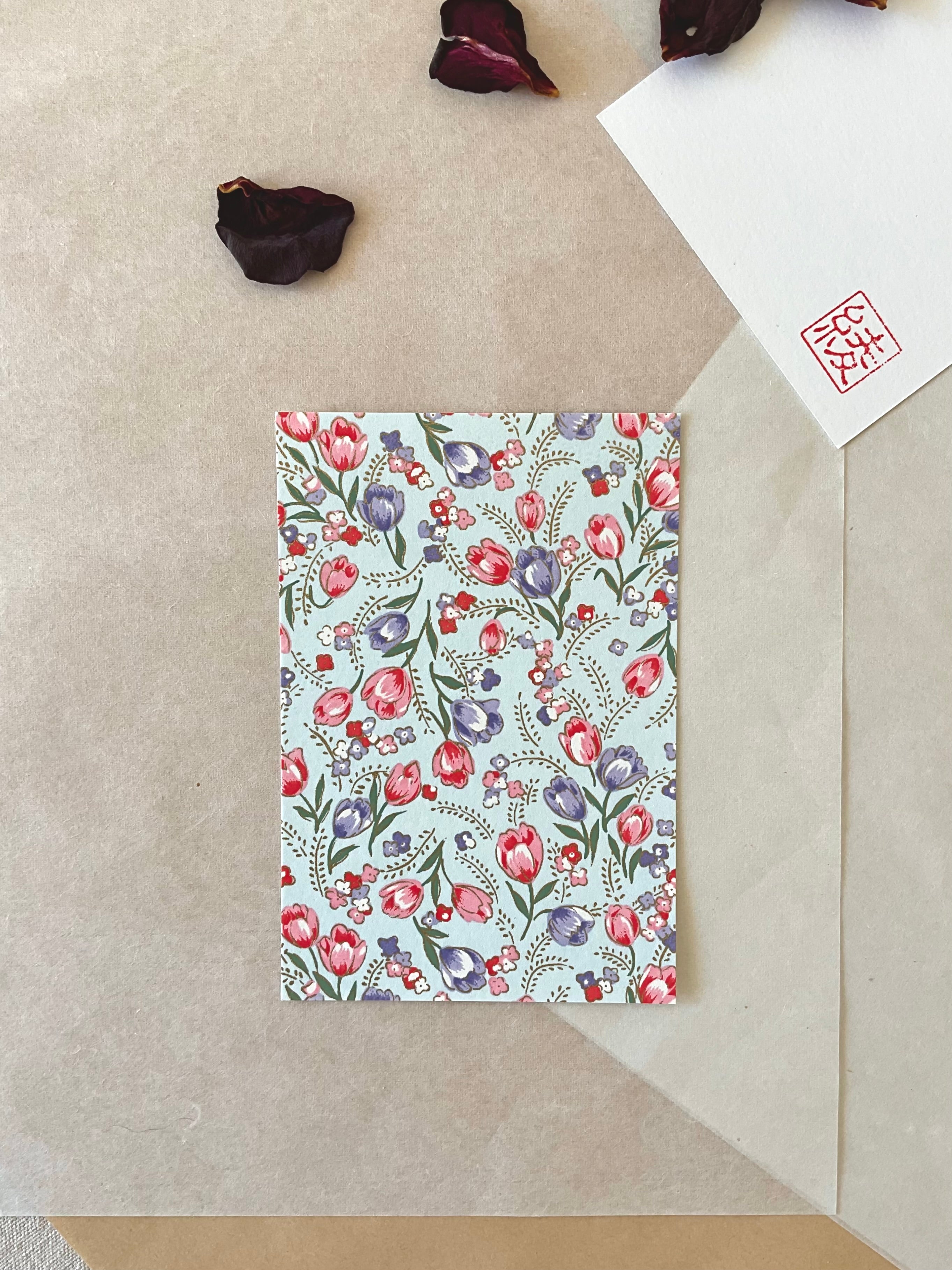 Morita Washi tulip pattern postcard showing dense pink and purple floral repeat on pale blue washi paper