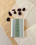Kyukyodo hanagami Japanese tissue paper pack with ichimatsu checkerboard pattern and calligraphy label