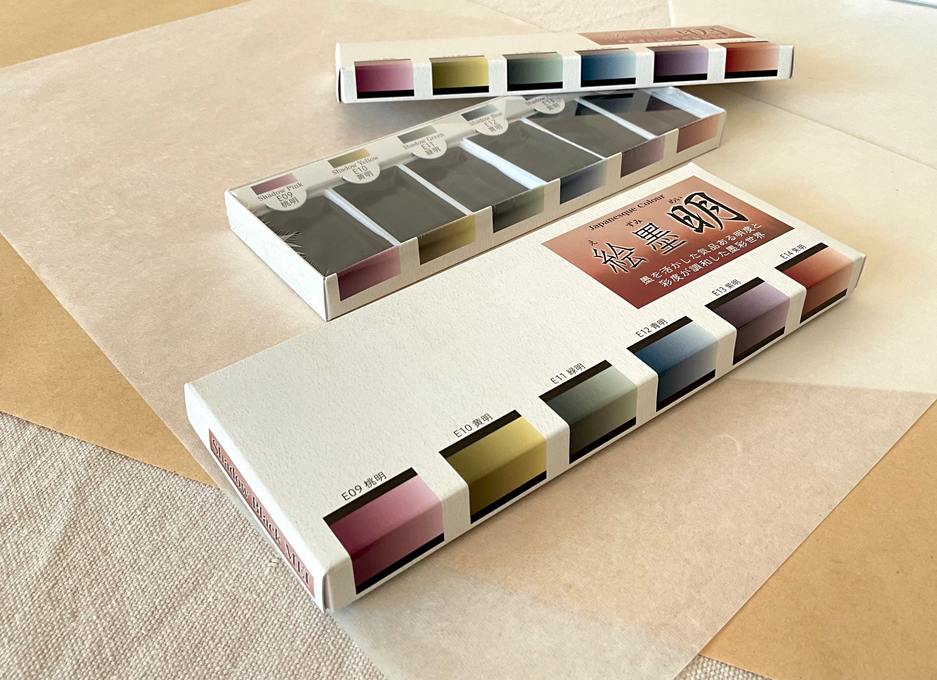 Two Ezumi Mei sets stacked open and closed showing color range on neutral background
