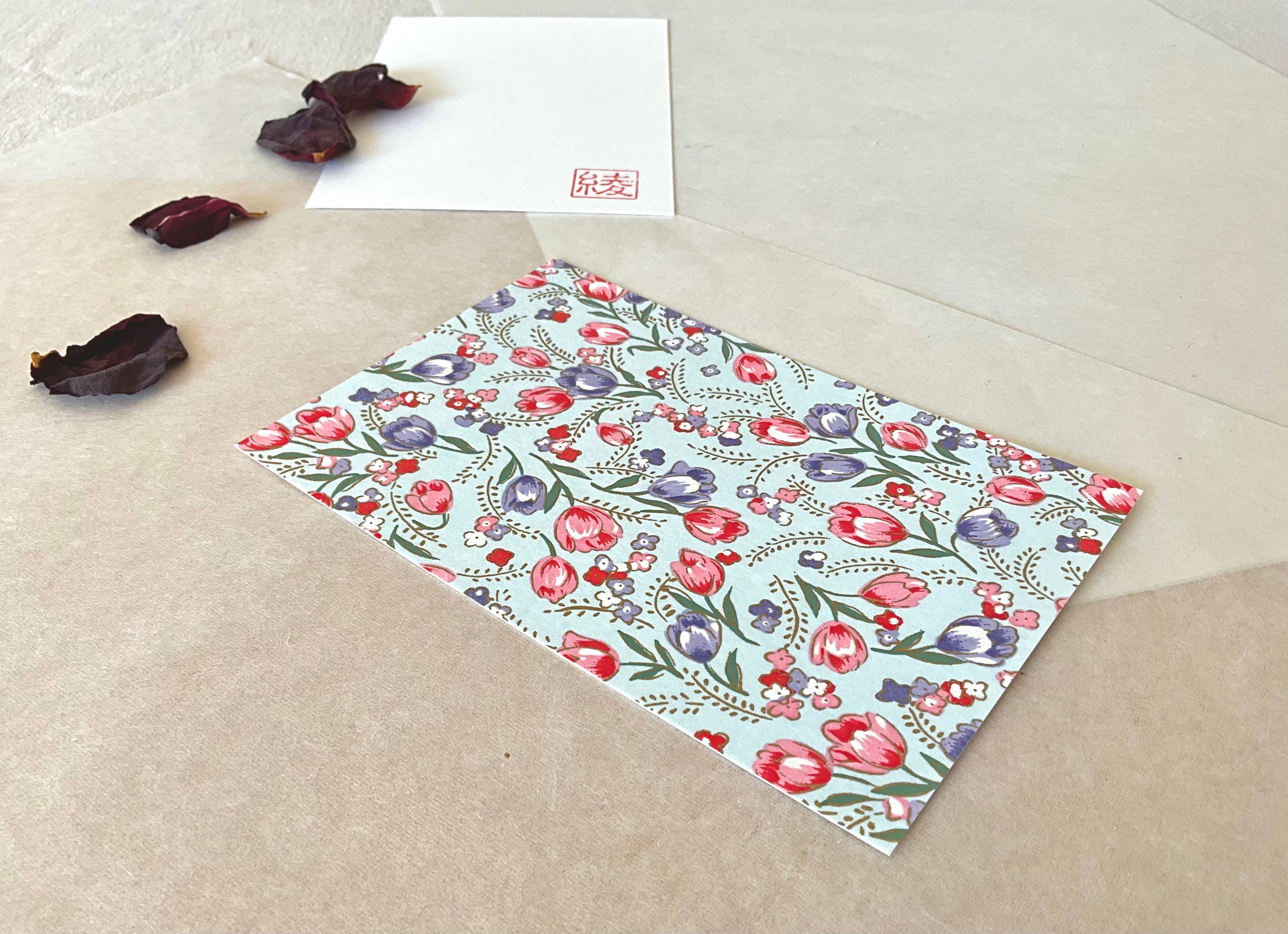 Morita Washi tulip postcard angled on layered washi paper with Aya hanko stamp in corner
