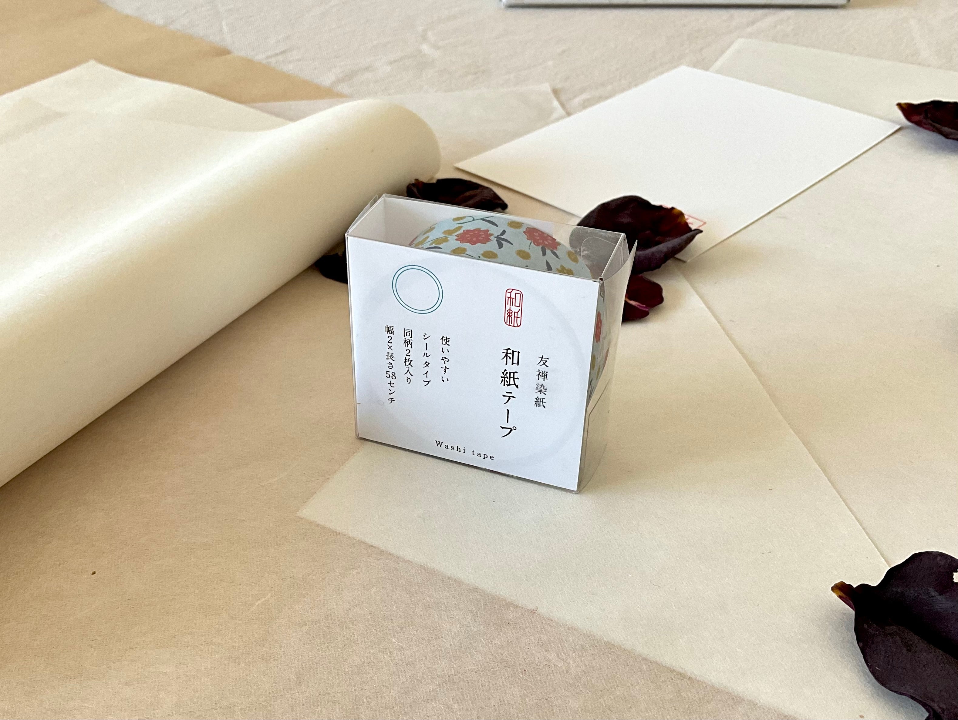 Sealed Shogado yuzen washi tape box with Japanese product label reading washi tape, two sheets same pattern, 2cm by 58cm, Pale blue with red flowers, mustard dots, navy leaves, on layered washi paper with dried rose petals