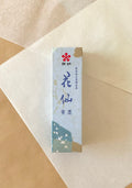 Kaimei Kasen Seiboku blue-black liquid ink in light blue presentation box on layered washi paper