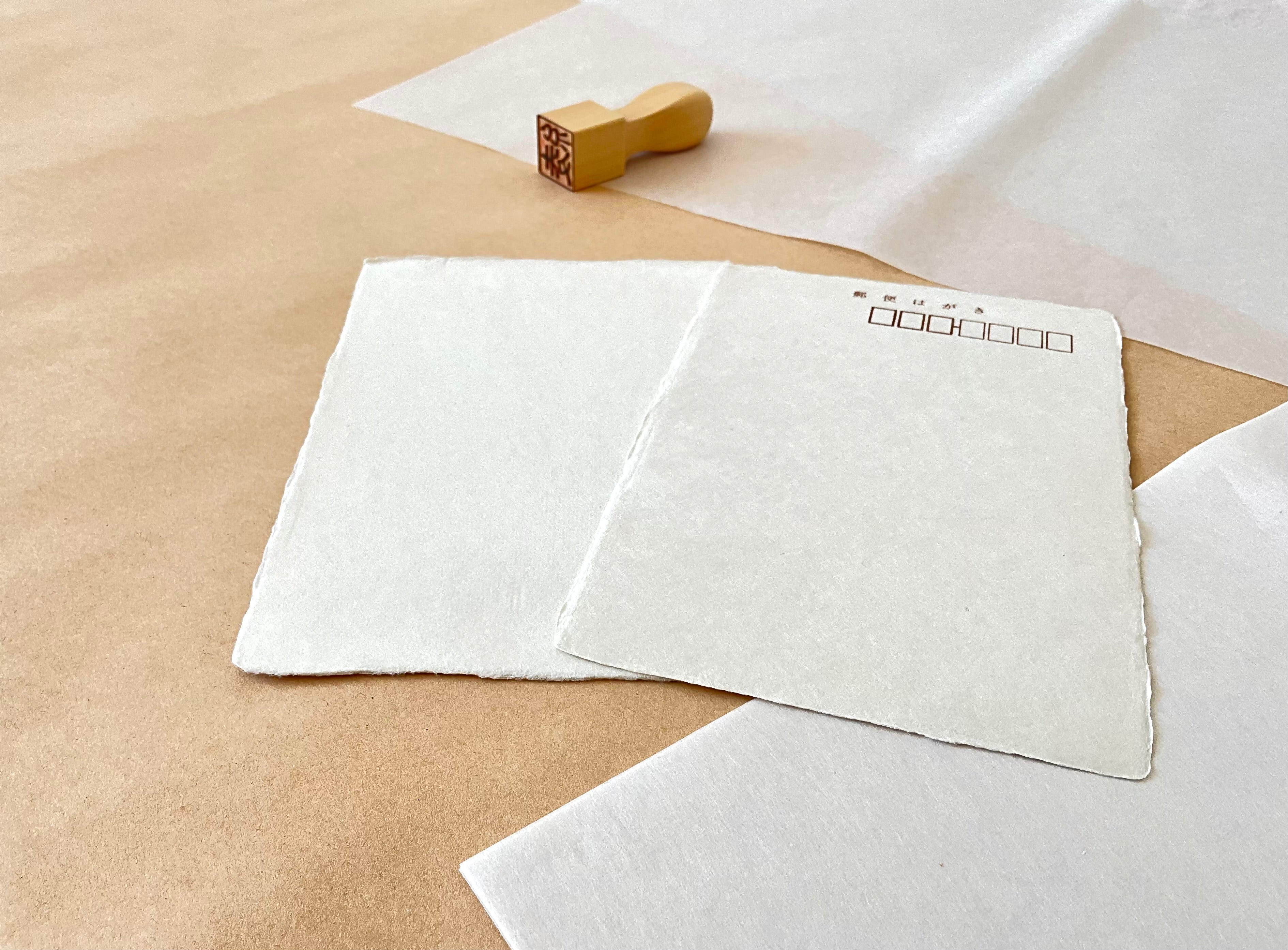 Kyukyodo cream washi postcard front and back showing natural texture and deckled edges on kraft paper
